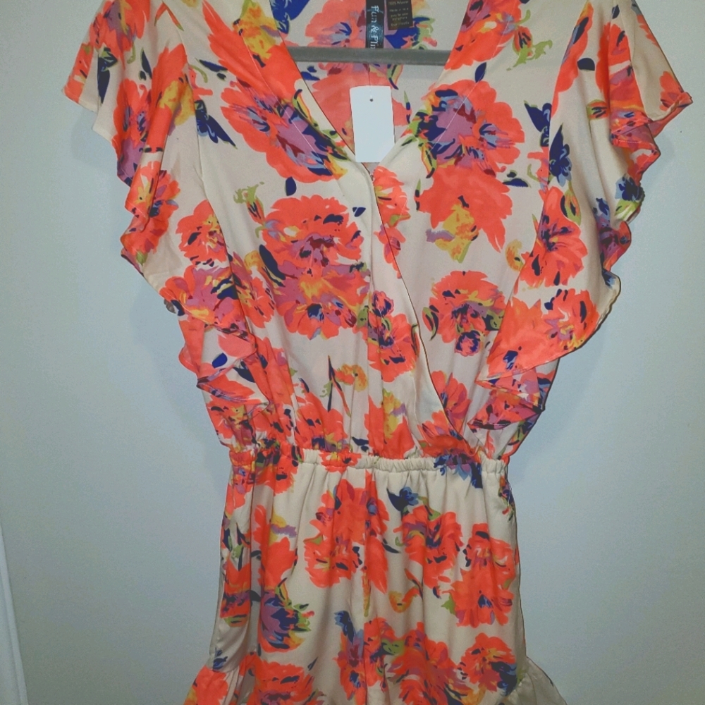 Amazingly cute romper with ruffle detail.
